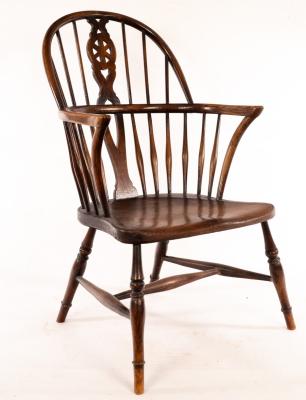 Appraisal: A stick and pierced splat back armchair with a solid