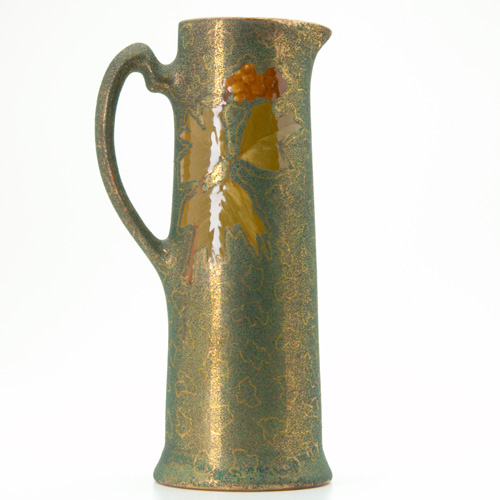 Appraisal: OWENS Coralene Opalesce tall pitcher painted with autumn leaves on