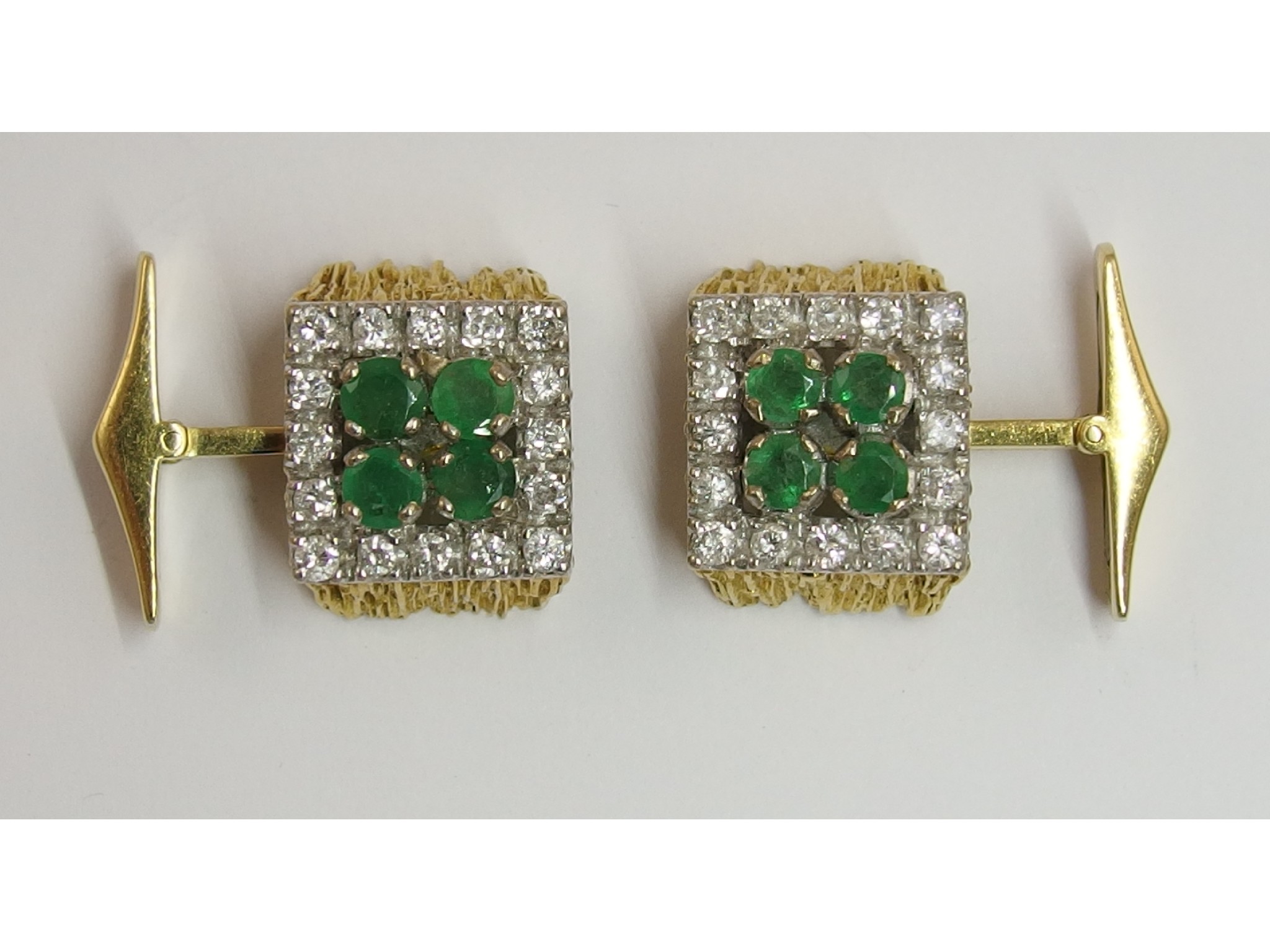 Appraisal: A pair of retro emerald and diamond cufflinksthe facet cut