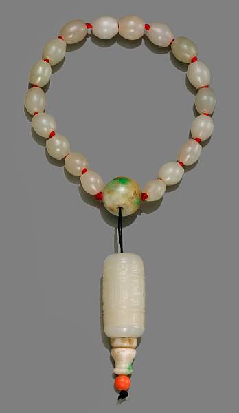 Appraisal: A jade mala The bracelet made from eighteen ovoid white