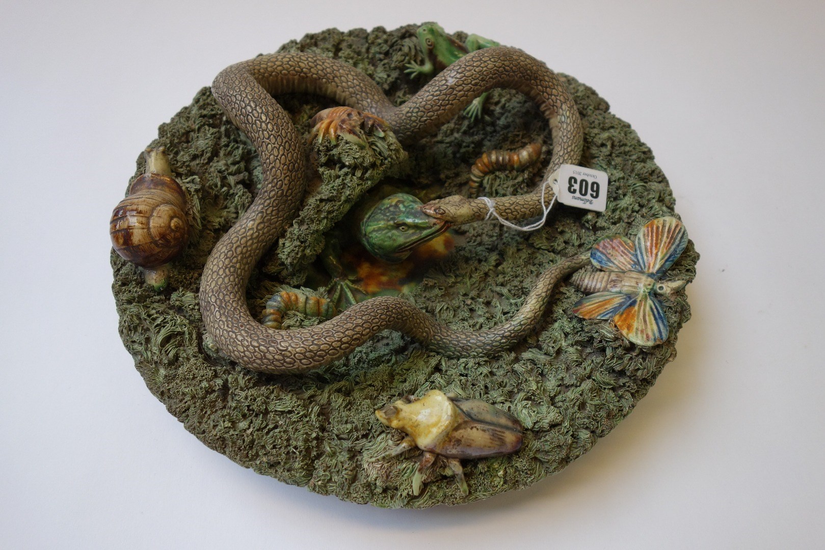 Appraisal: A Palissy style pottery charger late th century typically decorated