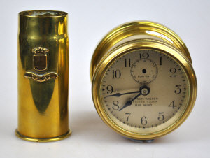 Appraisal: A rim wind brass cased bulkhead clock the silvered dial