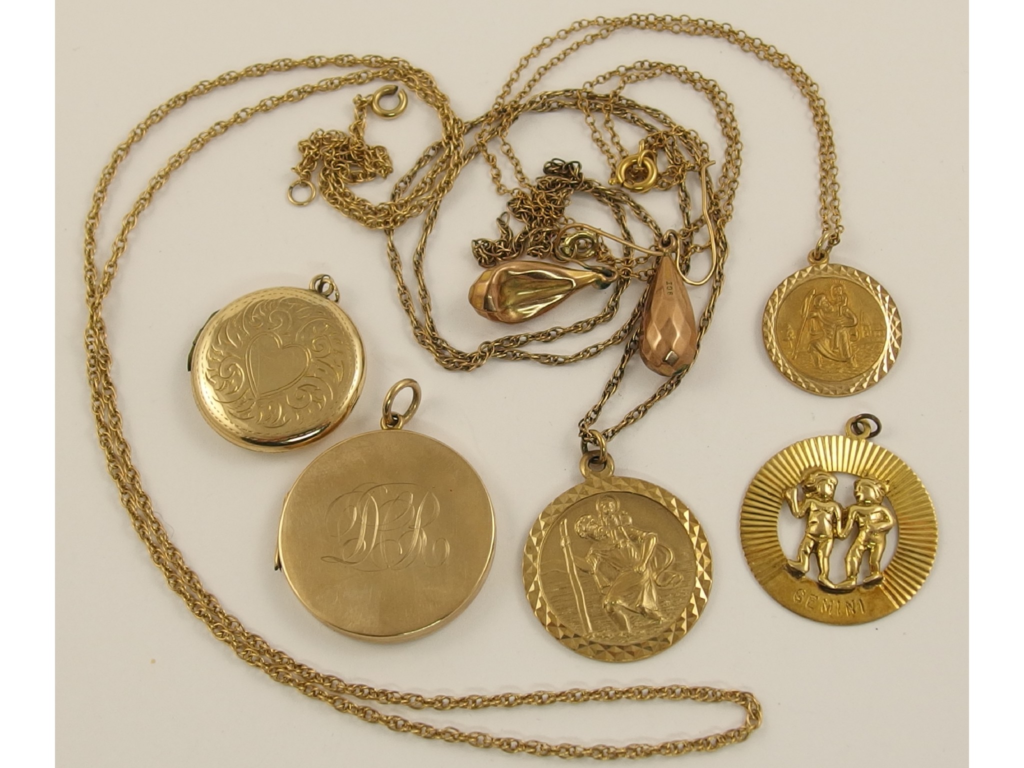 Appraisal: A collection of ct pendants back and front lockets chains