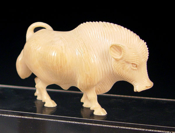 Appraisal: CARVED IVORY FIGURE OF A WILD BOAR Unsigned ''h x