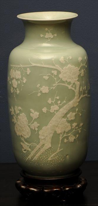 Appraisal: CHINESE CELADON-GLAZED BALUSTER-FORM VASE Relief painted with prunus branches on