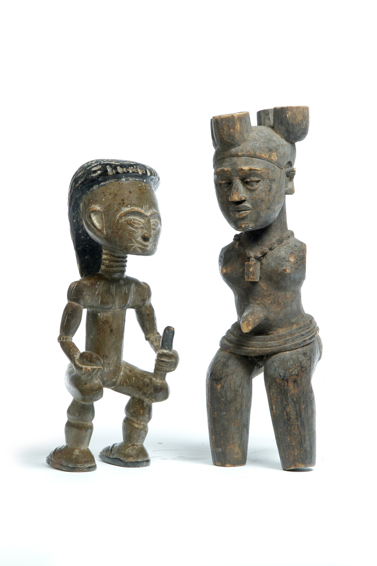 Appraisal: TWO AFRICAN CARVED WOODEN FIGURES Ghana mid th century Two