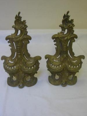 Appraisal: A PAIR OF FRENCH METAL FIRE DOGS in the Rococo