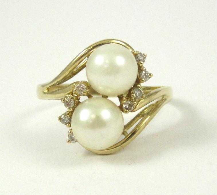 Appraisal: PEARL DIAMOND AND FOURTEEN KARAT GOLD RING set with eight