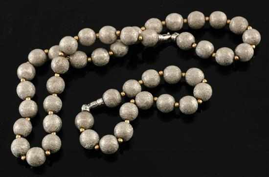 Appraisal: A gold necklace and bracelet The necklace comprising thirty two