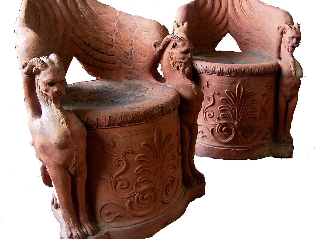 Appraisal: A pair of highly unusual Victorian terracotta orangery seats flanked