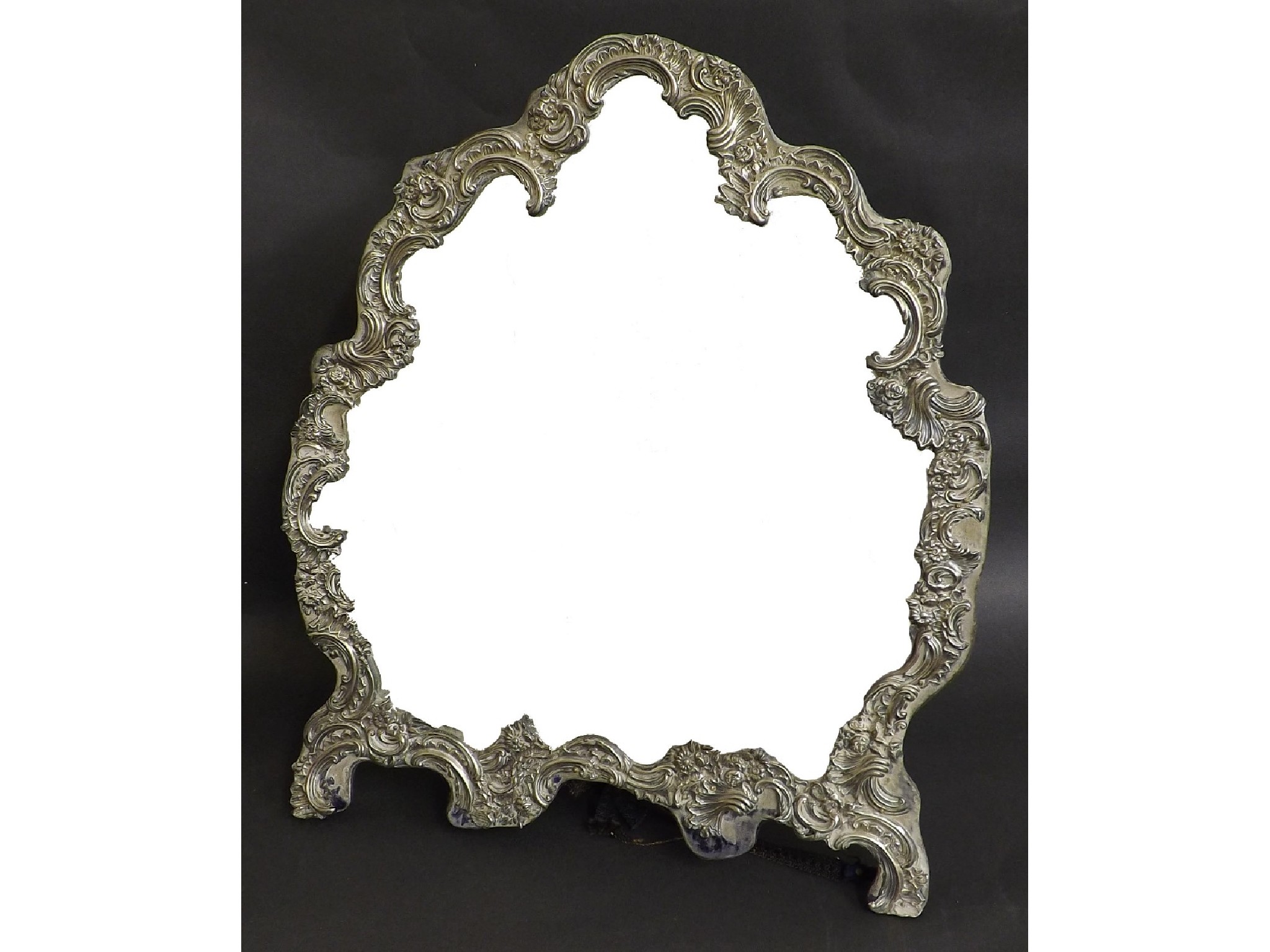 Appraisal: Edwardian silver easel dressing mirror with scrolled foliate frame and