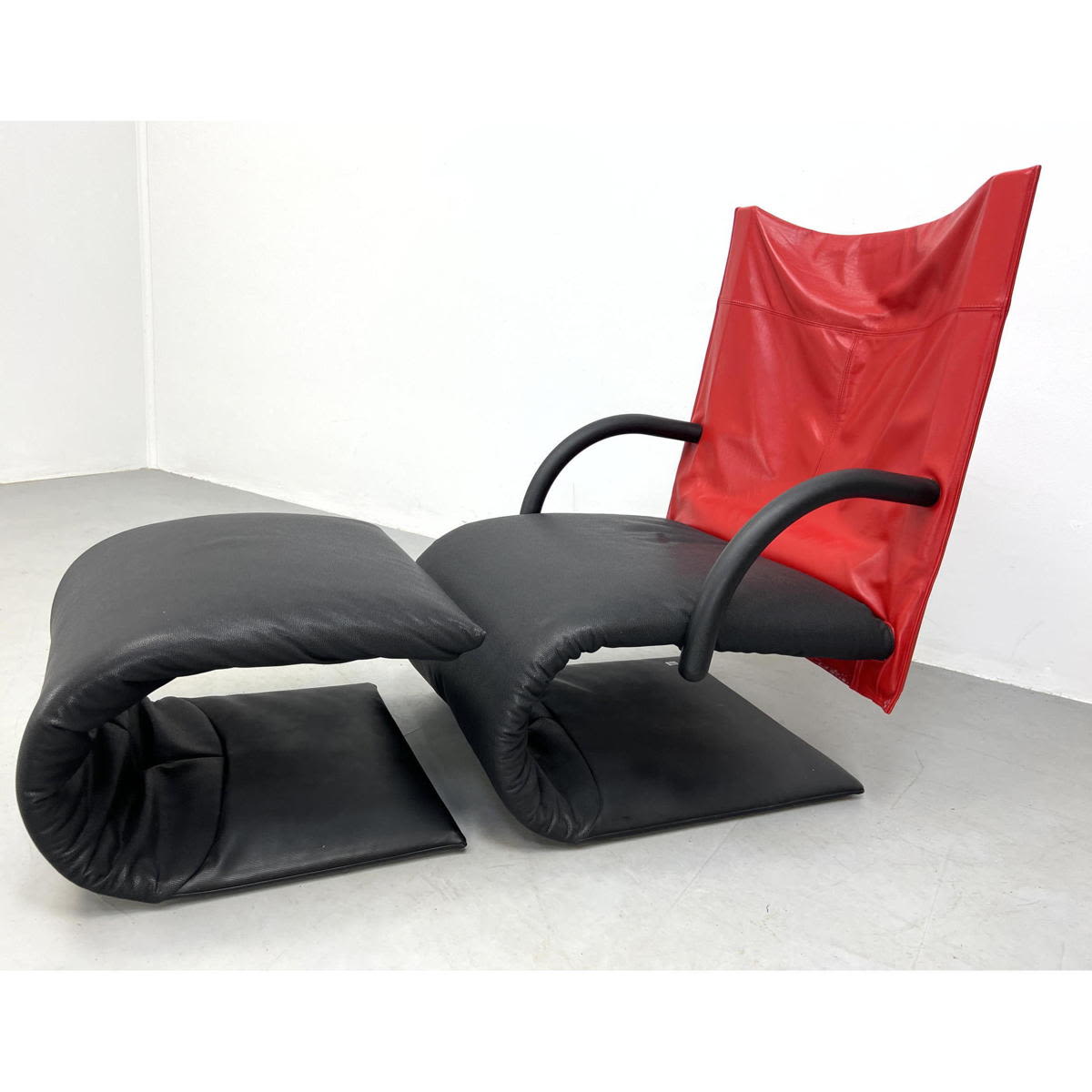 Appraisal: pc LIGNE ROSET Black Red Lounge Chair Ottoman Black Leather