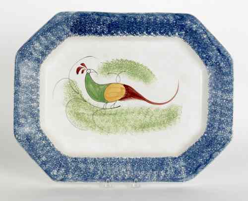 Appraisal: Blue spatter platter with a peafowl th c l w