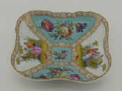 Appraisal: A Dresden centre dish of shaped lobed rectangular form with