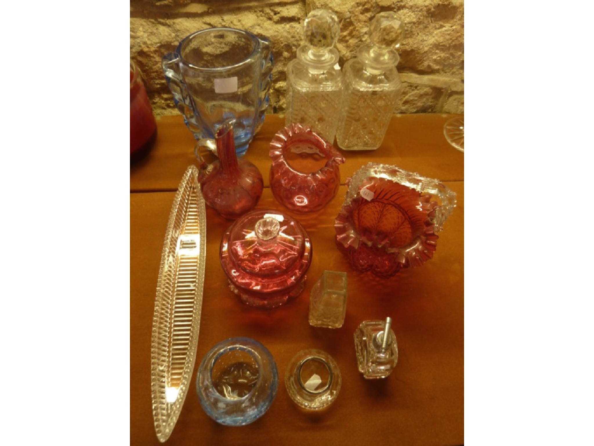 Appraisal: A selection of cranberry glass wares to include a basket