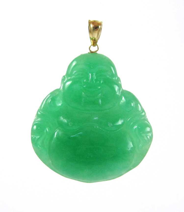 Appraisal: JADE AND FOURTEEN KARAT GOLD PENDANT with a carved green