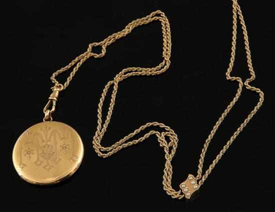 Appraisal: An Antique gold locket and chain The finely engined turned