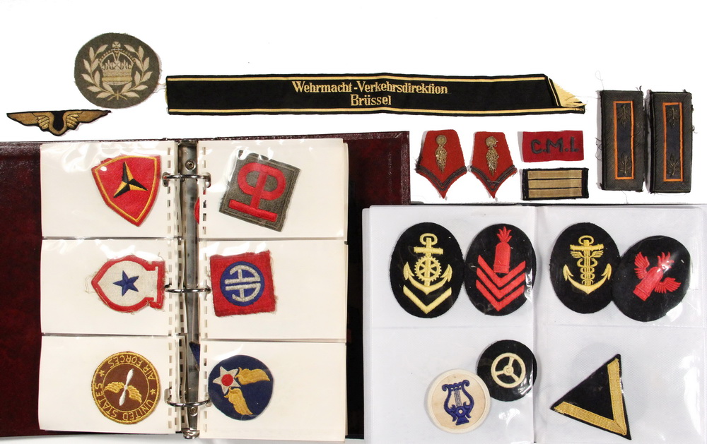 Appraisal: COLLECTION OF WWII MILITARY INSIGNIA - Two Binders containing British