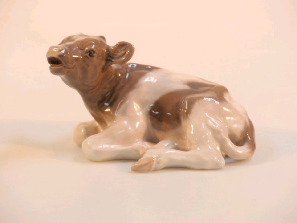 Appraisal: A Royal Copenhagen figure of a recumbent cow model no