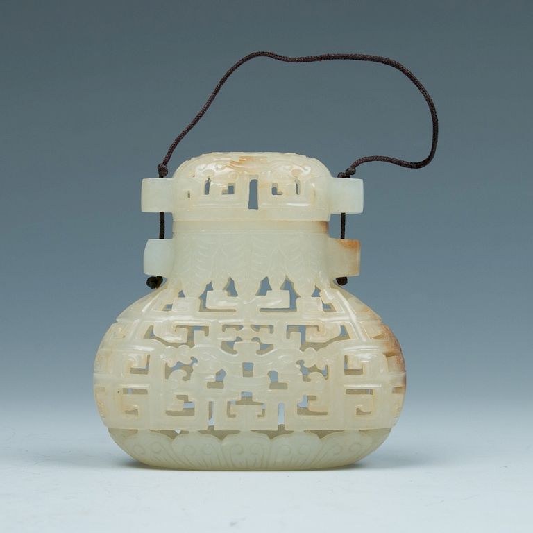 Appraisal: JADE PIERCED POMANDER QING Of a archaic hu form intricately