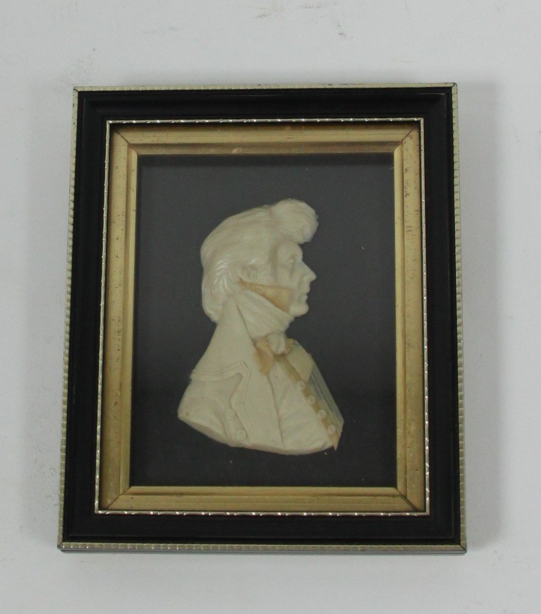 Appraisal: A rectangular wax relief portrait of a Gentleman with bouffant