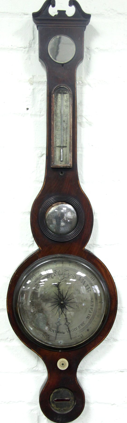 Appraisal: A mahogany banjo-shaped barometer and thermometer with silvered dial