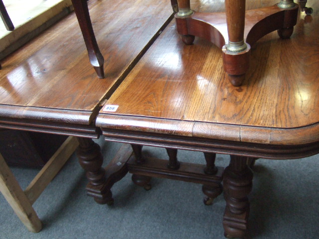 Appraisal: A th century French oak extending dining table of square