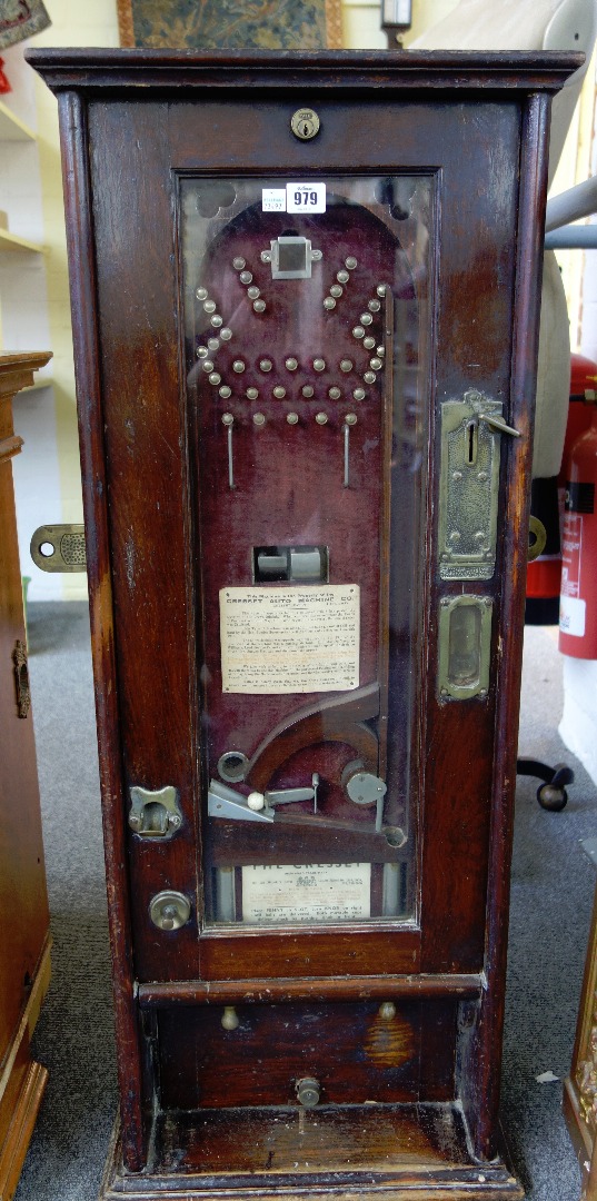 Appraisal: A Cresset penny slot bagatelle wall machine with an arrangement