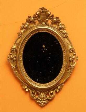 Appraisal: VICTORIAN GILTWOOD AND MOLDED GESSO OVAL MIRROR The frame decorated