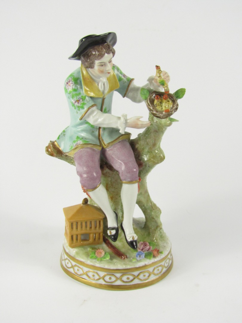 Appraisal: A Sitzendorf Porcelain figure of a man seated on a