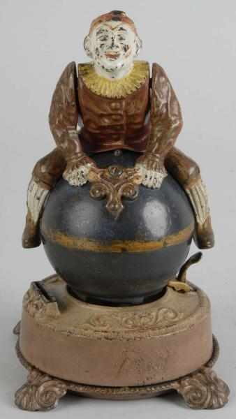 Appraisal: Cast Iron Clown on Globe Mechanical Bank Description Some crazing