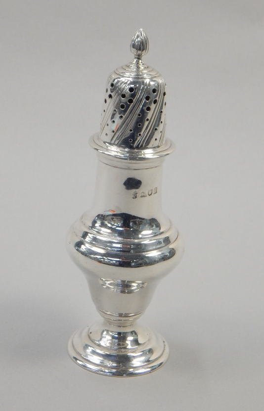 Appraisal: A silver baluster shaped sugar castor with flame finial and