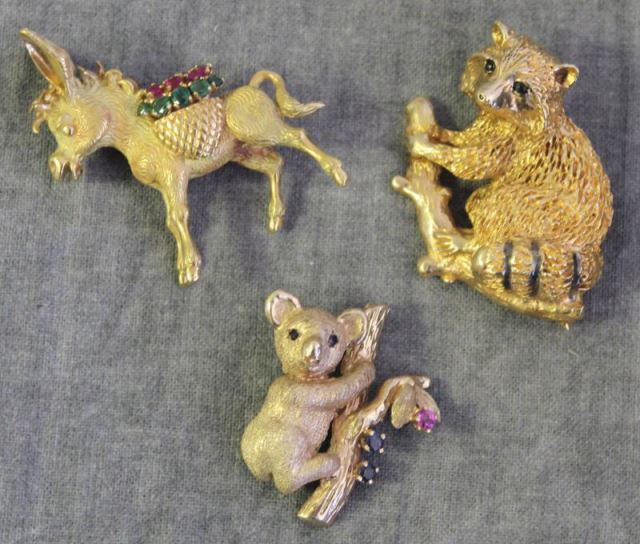 Appraisal: JEWELRY kt and kt Figural Brooch Grouping Includes a kt