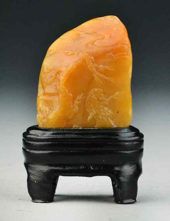 Appraisal: Chinese Tianhuang Stone PebbleFinely carved on both sides to depict