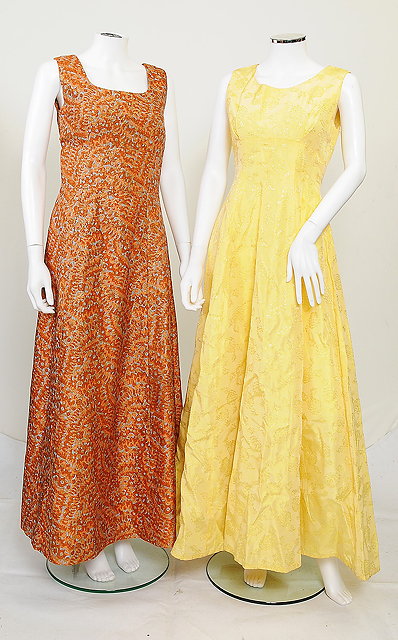 Appraisal: Two long evening dresses one in orange and blue pattern