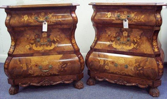 Appraisal: A pair of Dutch marquetry bombe front bedside chests each