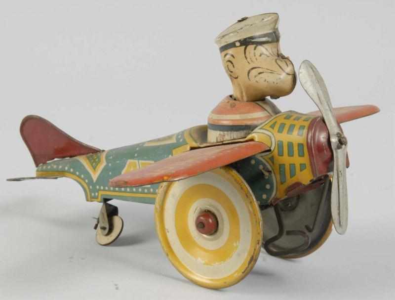 Appraisal: Tin Litho Marx Popeye the Pilot Wind-Up Toy Description American