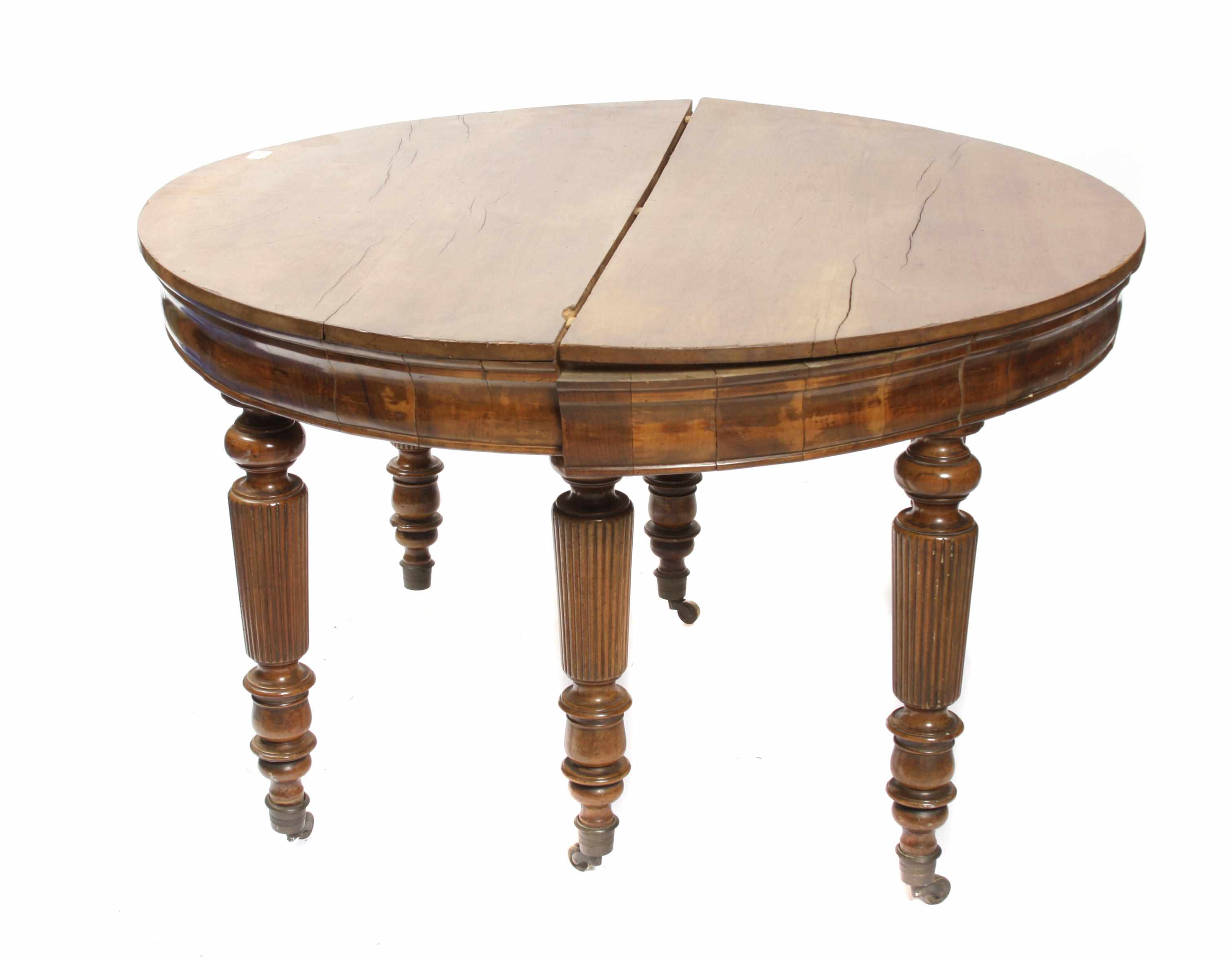 Appraisal: A Continental walnut extension dining table With two later leaves