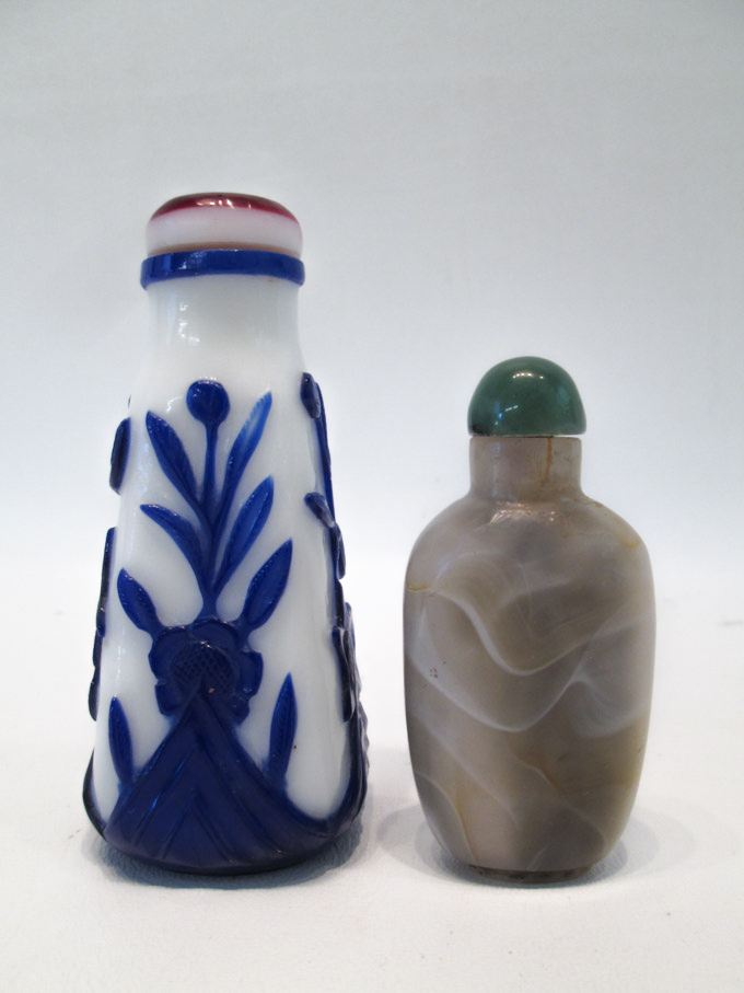 Appraisal: TWO CHINESE SNUFF BOTTLES a Peking glass bottle with blue