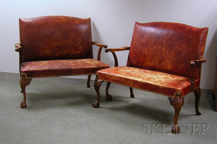 Appraisal: Pair of Georgian-style Leather Upholstered Carved Mahogany Settees lg in