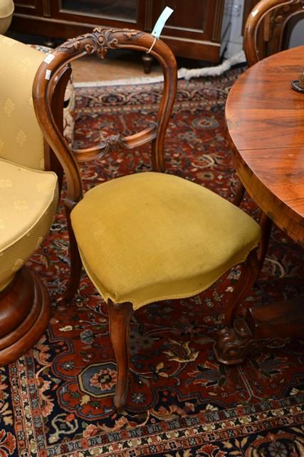 Appraisal: A SET OF FOUR VICTORIAN WALNUT BALLOON BACK CHAIRS A