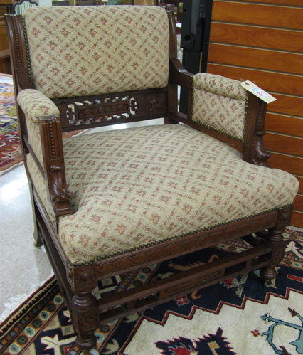 Appraisal: VICTORIAN CARVED AND UPHOLSTERED WALNUT ARMCHAIR Eastlake influence American c