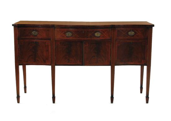 Appraisal: Regency style inlaid mahogany serpentine sideboard late th century shaped