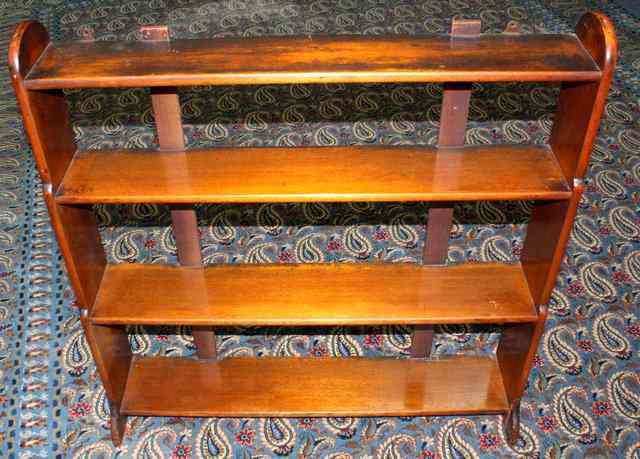 Appraisal: A SET OF LATE GEORGIAN MAHOGANY WALL MOUNTED SHELVES four