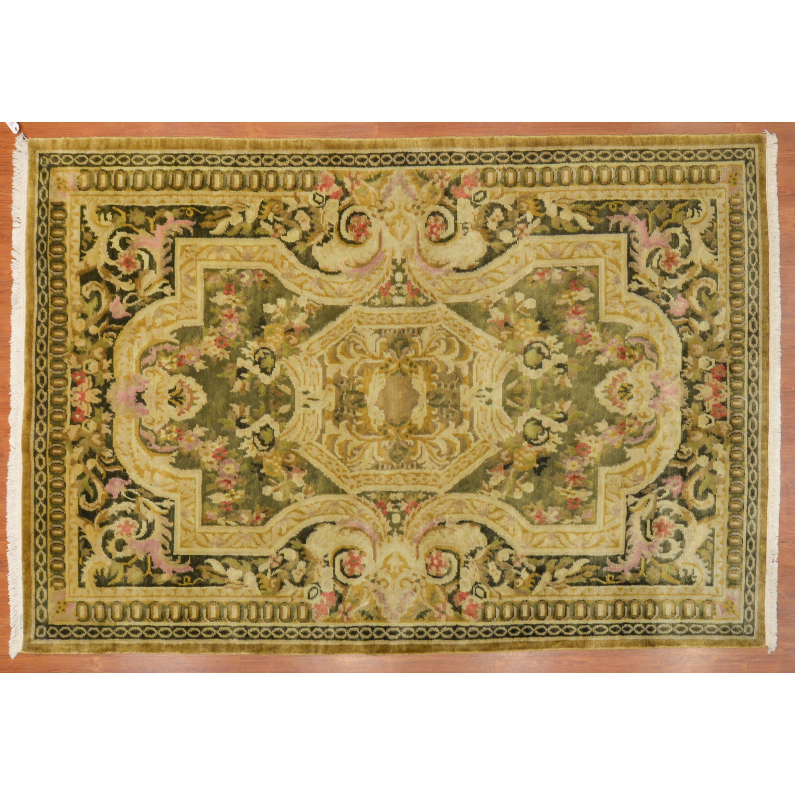 Appraisal: FLORAL AND TRELLIS DESIGN RUG INDIA X Modern hand-knotted wool