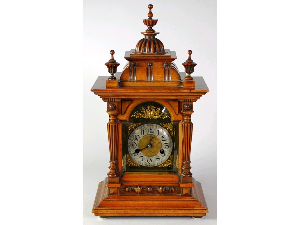 Appraisal: LATE NINETEENTH CENTURY GERMAN WALNUT MANTEL CLOCK the arched dial