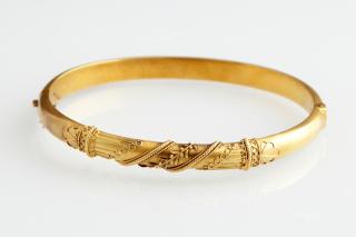 Appraisal: English K Yellow Gold Hinged Bangle Bracelet c with relief