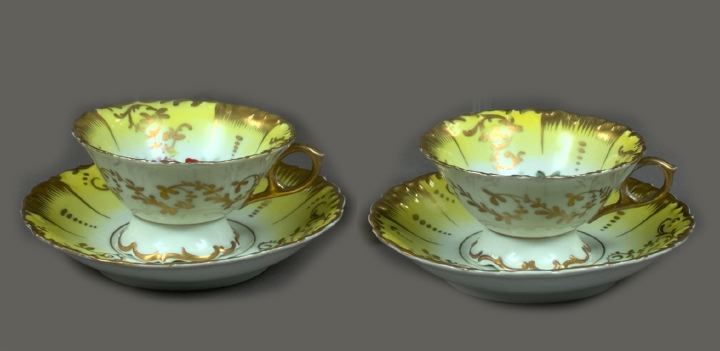 Appraisal: Two Continental Fond Jaune Porcelain Teacups and Saucers first quarter