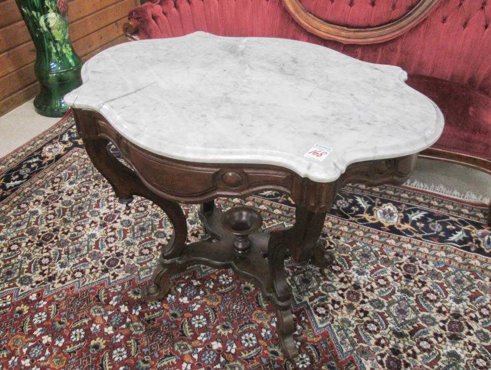 Appraisal: VICTORIAN MARBLE-TOP WALNUT LAMP TABLE American late th century with