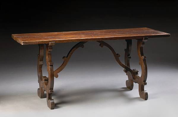 Appraisal: An Italian Renaissance style walnut library table partially composed of